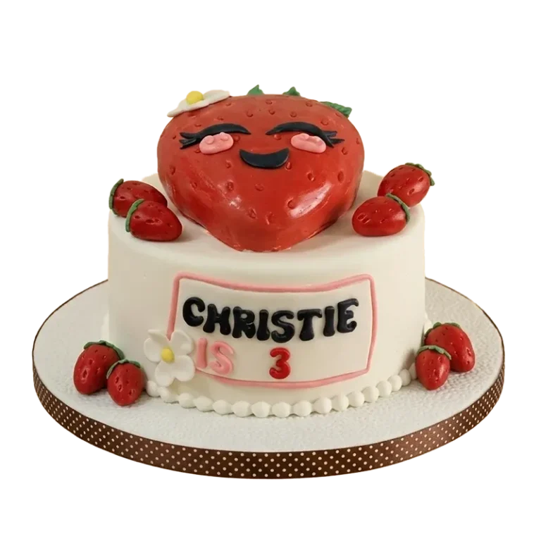 Kawaii strawberry birthday cake with smiling strawberry character figure, fresh strawberry accents, and Christie is 3 inscription