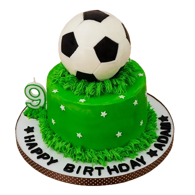 Green soccer pitch birthday cake with 3D soccer ball, grass texture, number nine candle, and Happy Birthday Adam inscription