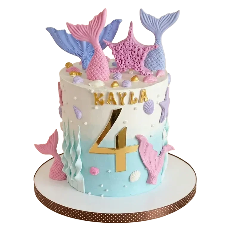Mermaid ombré birthday cake with pink and purple mermaid tails, seashells, seaweed, and Kayla 4 inscription