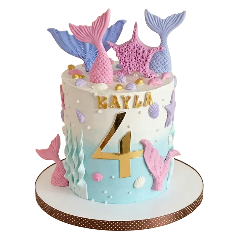 Mermaid ombré birthday cake with pink and purple mermaid tails, seashells, seaweed, and Kayla 4 inscription