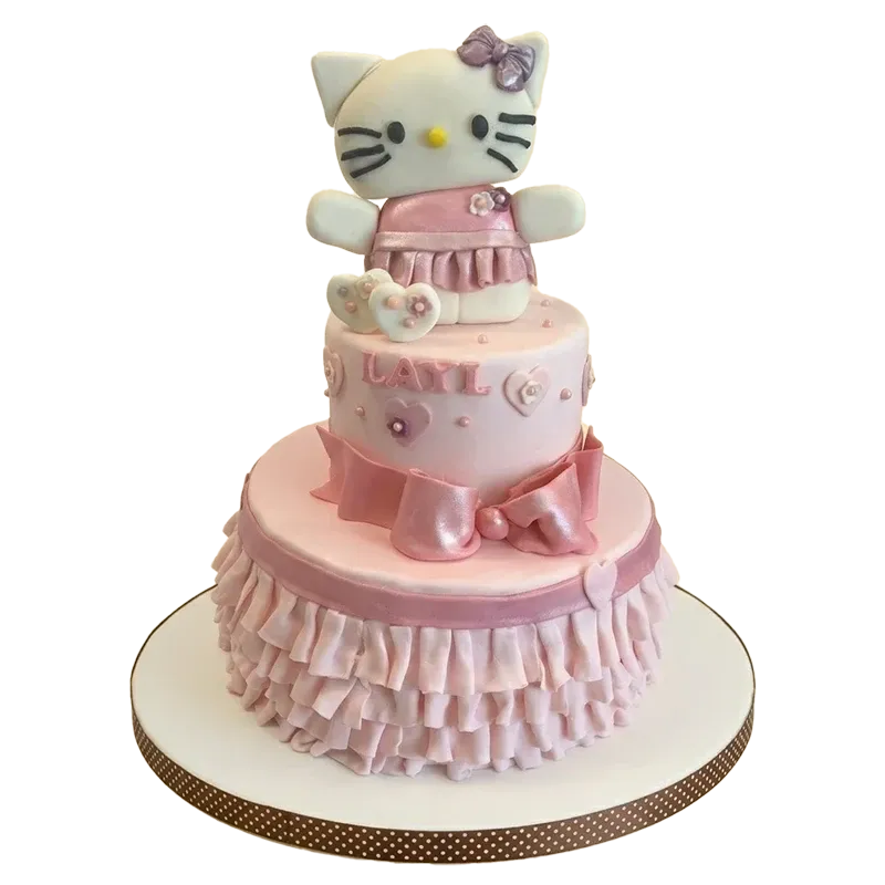 Two-tier pink Hello Kitty birthday cake with sculpted Hello Kitty figure, ruffled tiers, and Layla name inscription