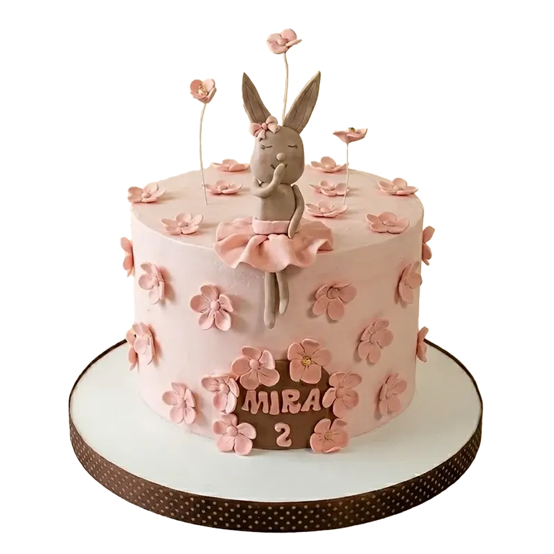 Pink ballerina bunny birthday cake with bunny ballerina figure, pink blossom flowers, and Mira 2 inscription