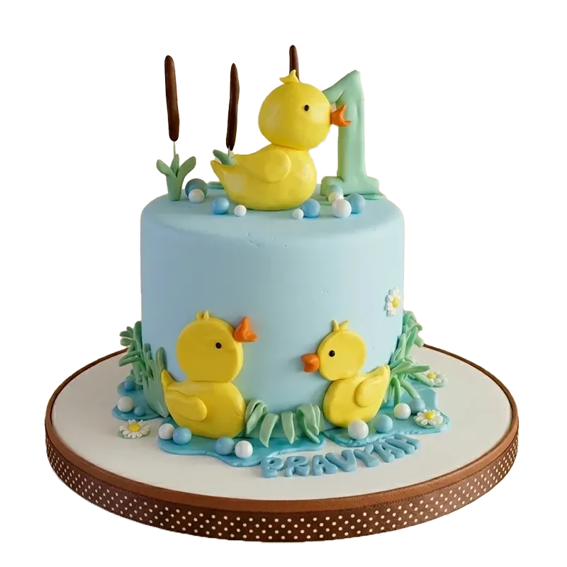 Light blue first birthday cake with yellow rubber ducks, cattails, number one topper, and Pravyah inscription