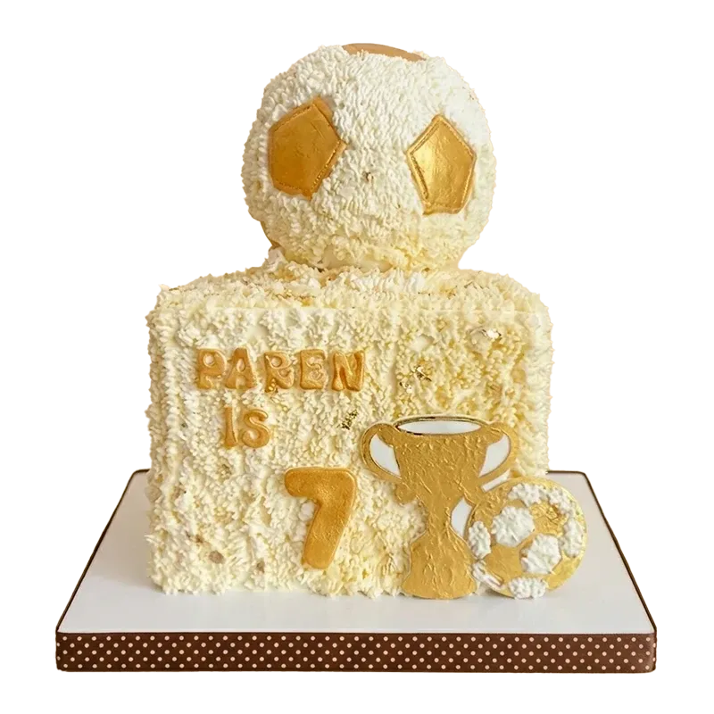 Square soccer birthday cake with 3D gold soccer ball topper, gold trophy, and Paren is 7 inscription
