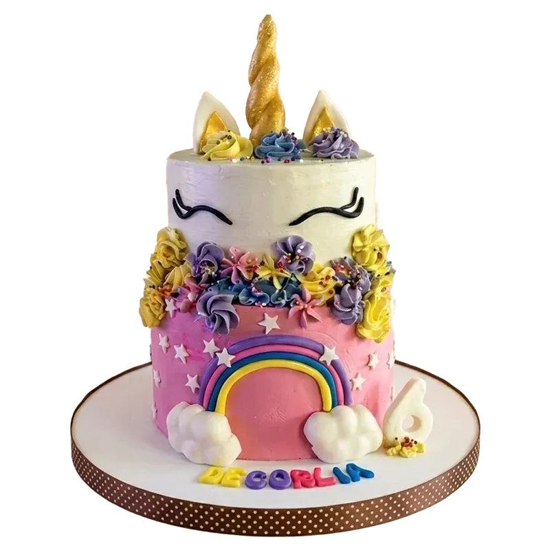 Two-tier unicorn birthday cake with gold horn, rainbow, colorful flowers, and De Gorlia name inscription