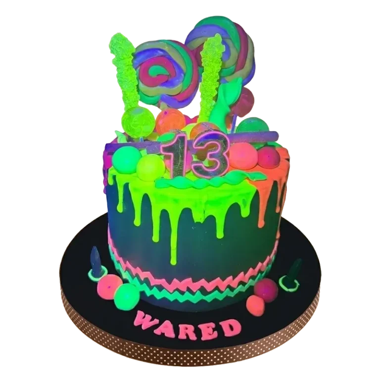Neon glow birthday cake with green drip, candy toppers, number 13, and Wared name inscription