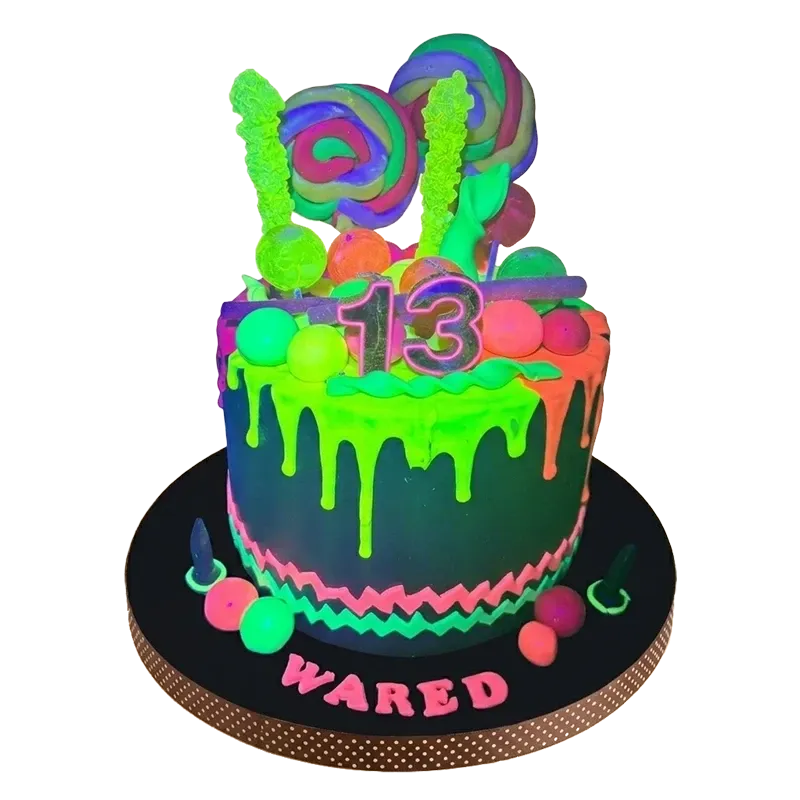 Neon glow birthday cake with green drip, candy toppers, number 13, and Wared name inscription