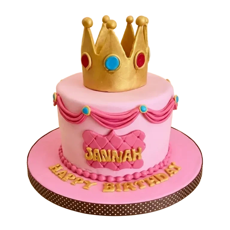 Pink royal princess birthday cake with gold crown topper, jewel accents, and Jannah Happy Birthday inscription