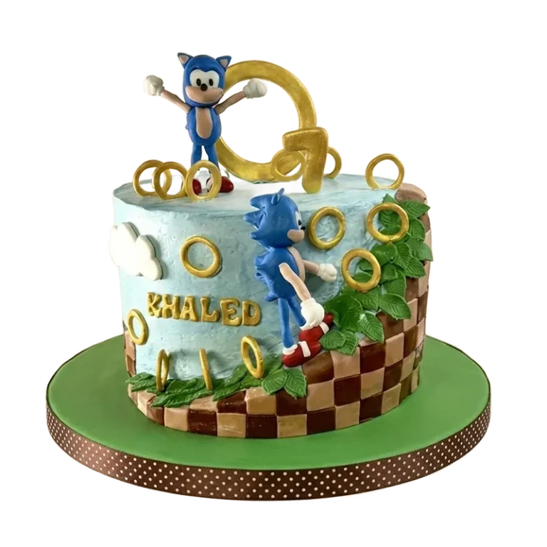 Sonic the Hedgehog Green Hill Zone birthday cake with Sonic figures, gold rings, and Khaled name inscription
