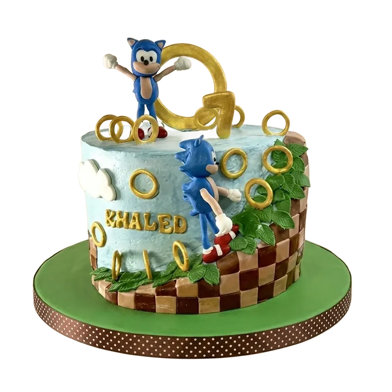 Sonic the Hedgehog Green Hill Zone birthday cake with Sonic figures, gold rings, and Khaled name inscription