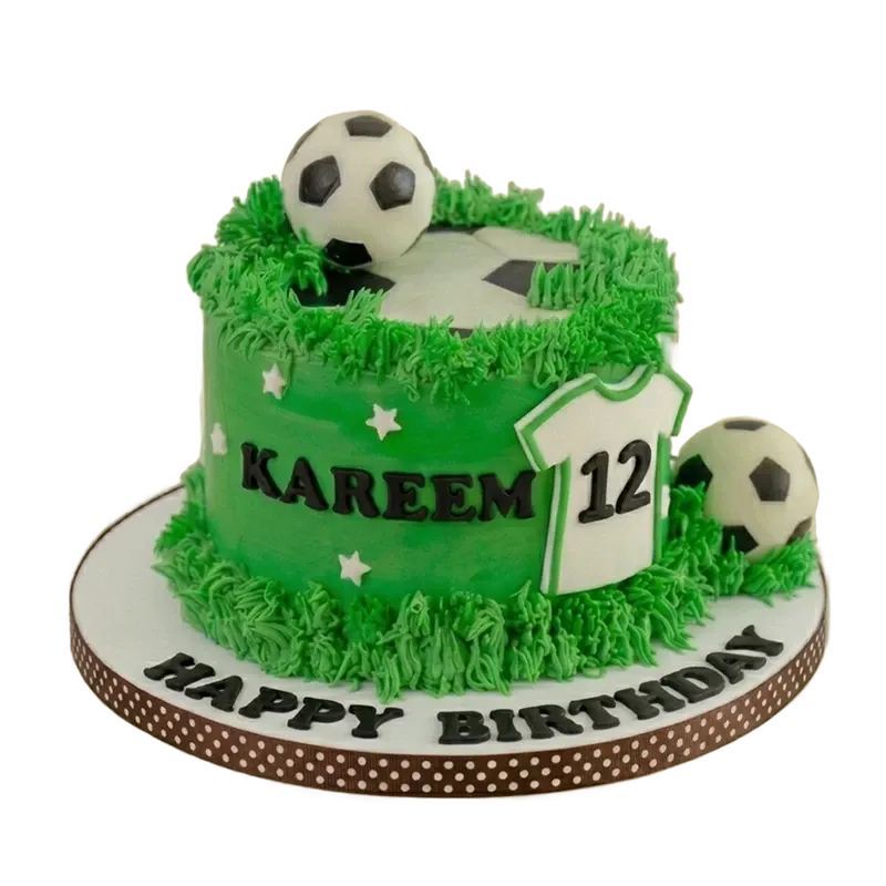 Green soccer field birthday cake with soccer balls, jersey number twelve, and grass texture