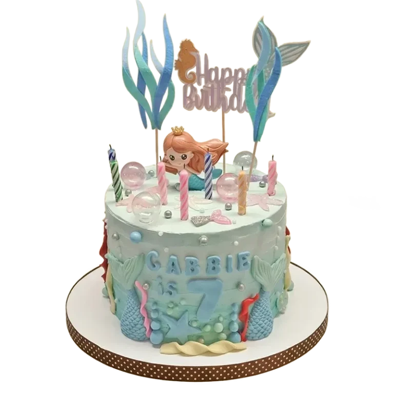 Teal mermaid birthday cake with mermaid figure, seaweed, seahorse, and bubble sphere decorations