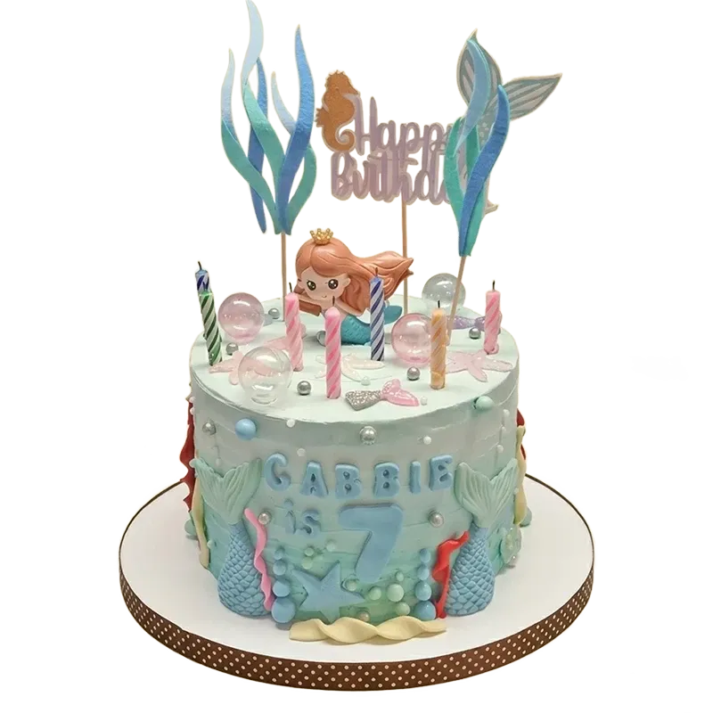 Teal mermaid birthday cake with mermaid figure, seaweed, seahorse, and bubble sphere decorations