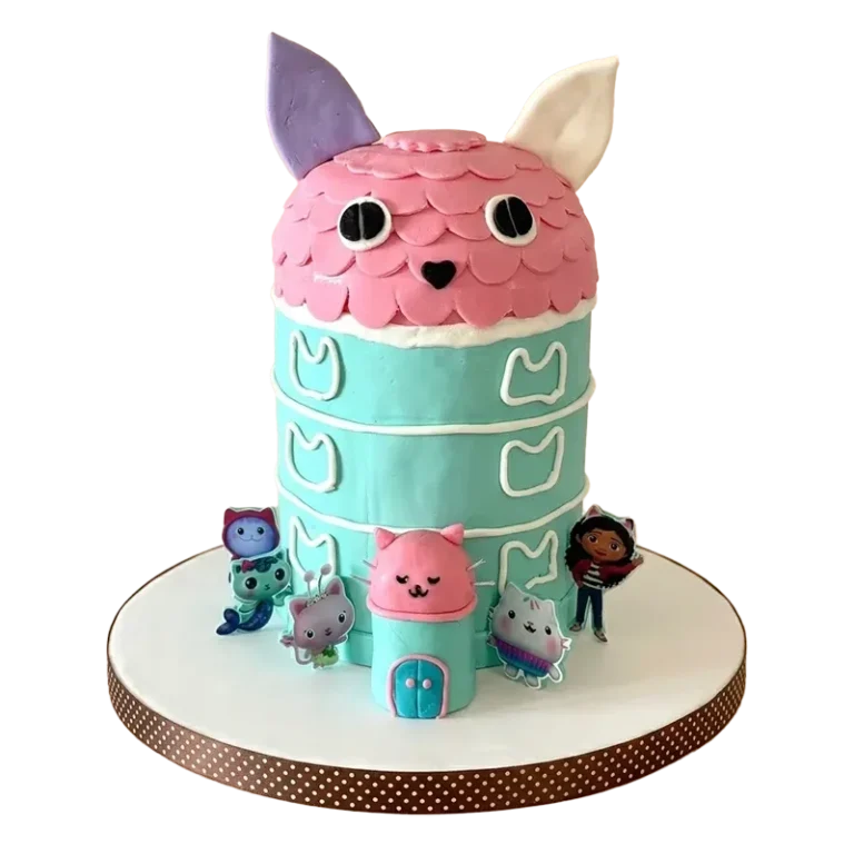 Gabby's Dollhouse birthday cake shaped as pink and teal cat house with character figures