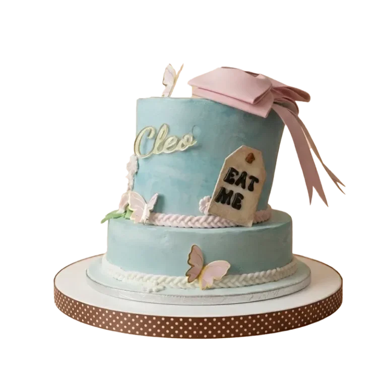 Two-tier Alice in Wonderland birthday cake with pink bow, Eat Me tag, butterflies, and Cleo name inscription