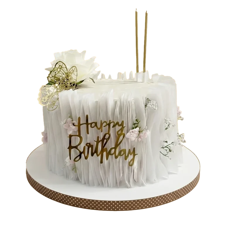 White ruffle-textured birthday cake with gold butterfly, pink mini roses, and gold script