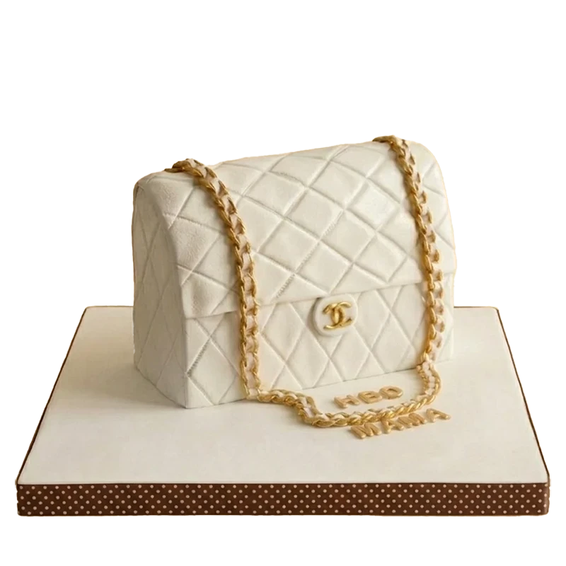 Birthday cake sculpted as a white quilted Chanel handbag with gold chain strap and CC logo