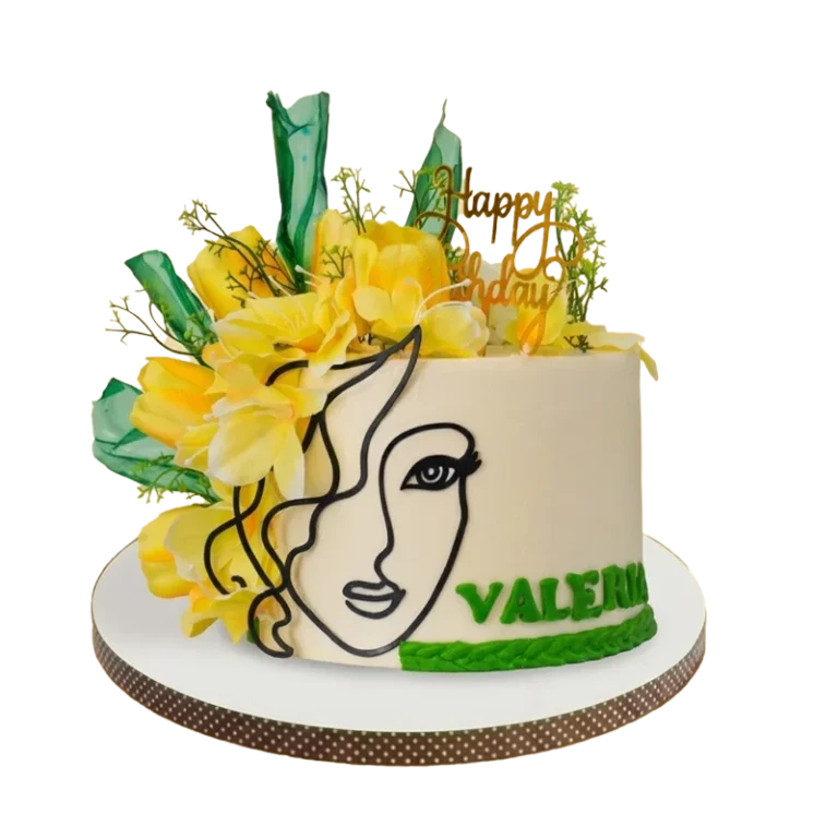 White birthday cake with artistic female face silhouette, yellow flowers, and green tropical leaves