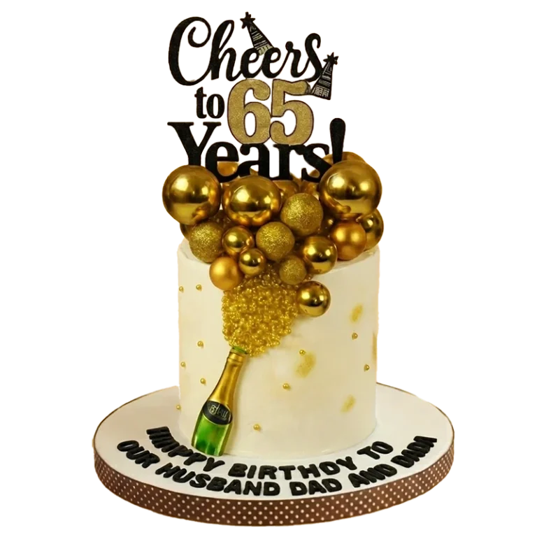 White 65th birthday cake with champagne bottle, gold sphere burst, and Cheers to 65 Years topper