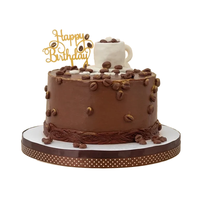 Chocolate coffee-themed birthday cake with scattered coffee beans, espresso cup, and gold topper