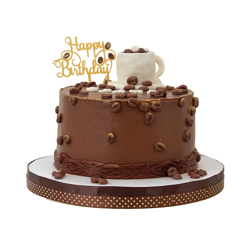 Chocolate coffee-themed birthday cake with scattered coffee beans, espresso cup, and gold topper