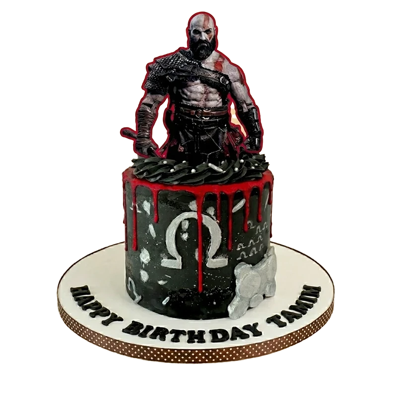 God of War birthday cake with Kratos figure, red drip, Omega symbol, and birthday inscription