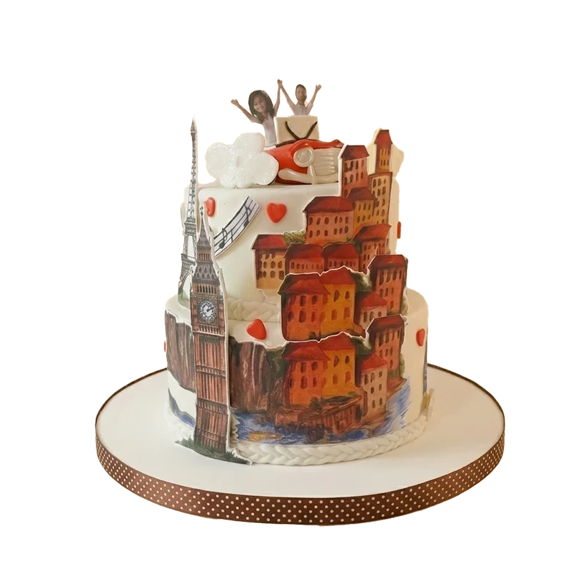 Travel-themed birthday cake with painted European cityscape, Eiffel Tower, and couple figures