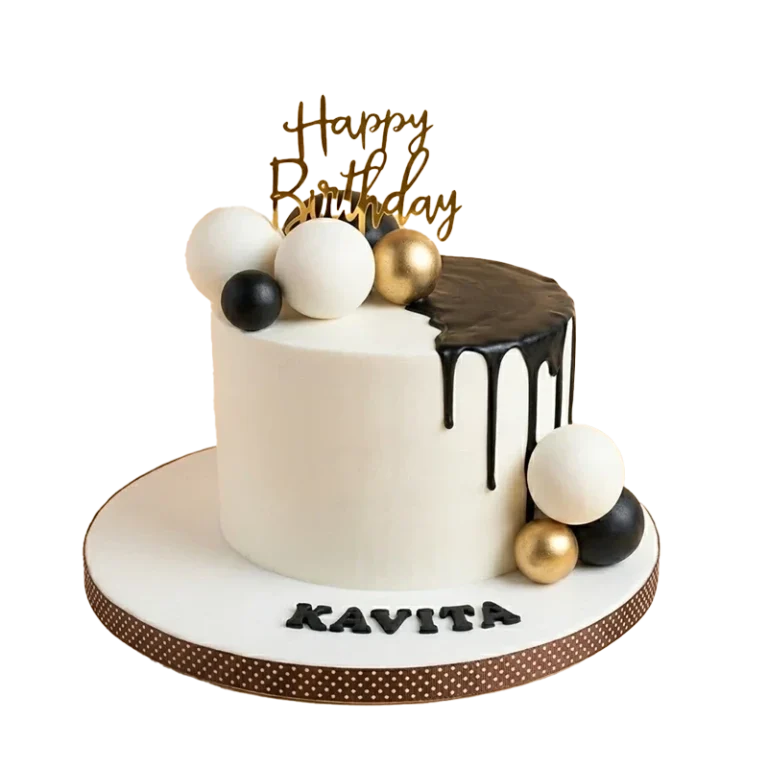 Elegant birthday cake with chocolate drip, gold and white sphere clusters, and gold topper
