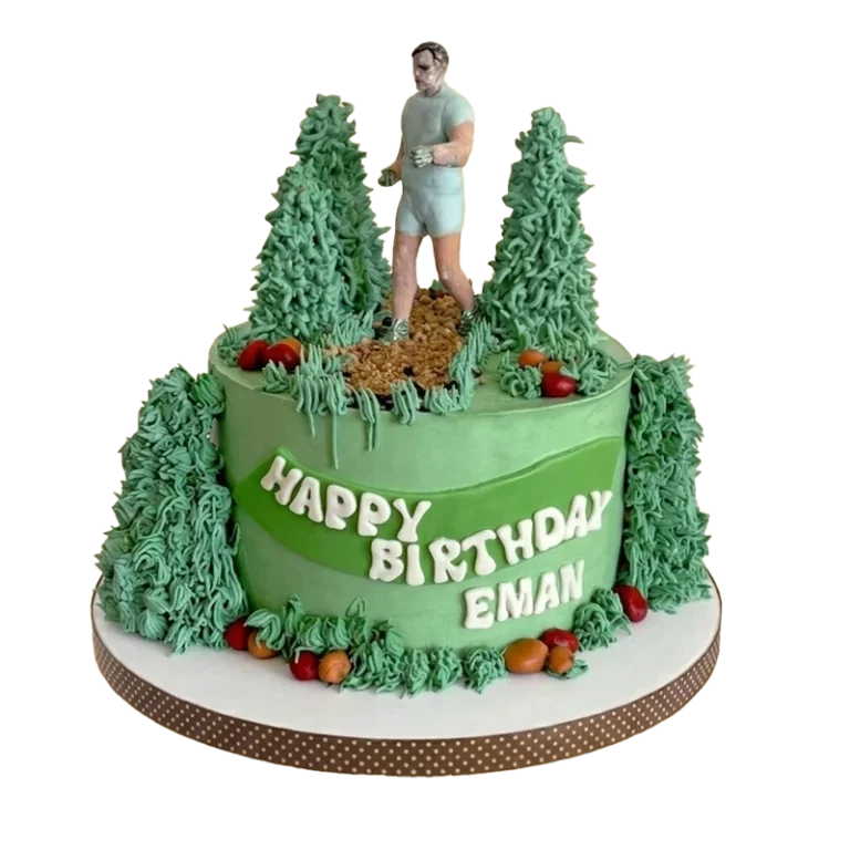 Green trail runner birthday cake with jogger figure, pine trees, and name inscription
