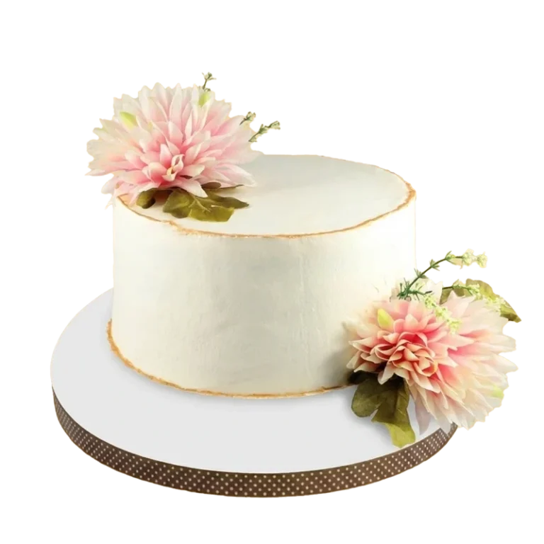 Minimalist white cake adorned with large pink dahlia flowers and green foliage