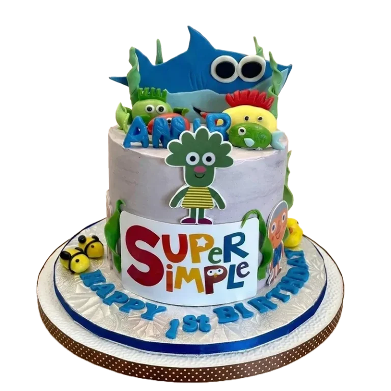 Two-tier first birthday cake with Super Simple Songs characters and Happy 1st Birthday inscription