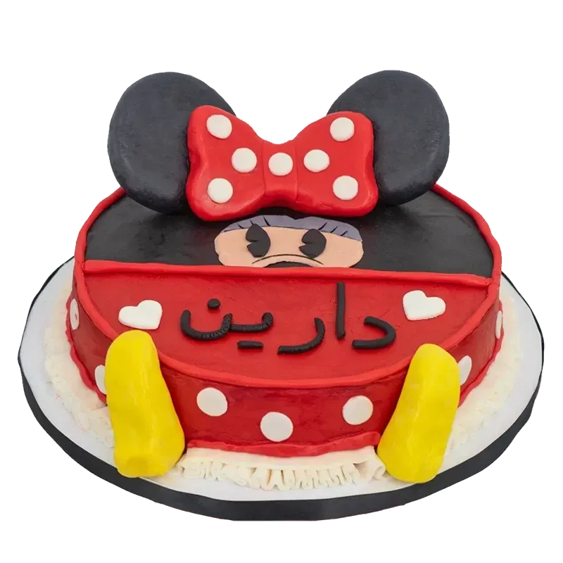 Classic Minnie Mouse birthday cake in red with polka dots, bow, and Arabic name inscription