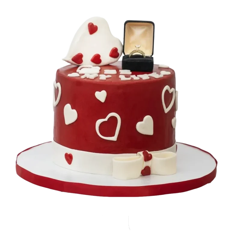 Red anniversary proposal cake with white hearts, engagement ring box topper, and bow at base