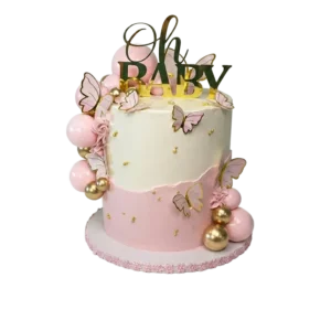 Two-tier pink baby shower cake with butterflies, pink and gold balloon clusters, and Oh Baby topper