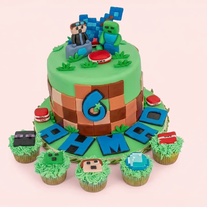 Minecraft birthday cake with green grass top, block body, Steve and Creeper toppers, and themed cupcakes