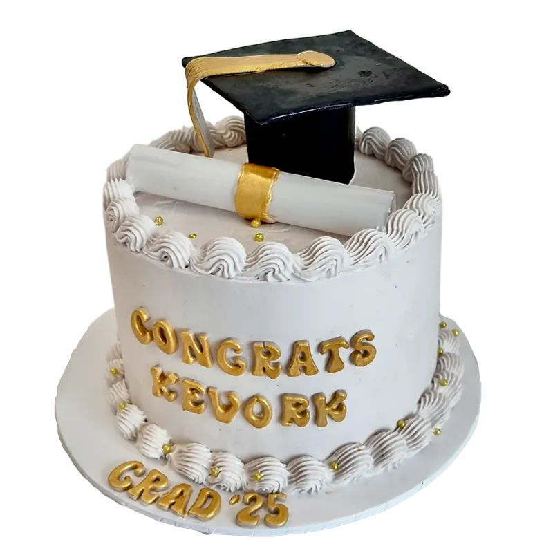 White graduation cake with gold cap and diploma topper and Congrats Grad gold letter inscription