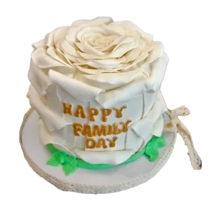 White Blooming Rose cake with large sculpted rose topper and Happy Family Day gold inscription