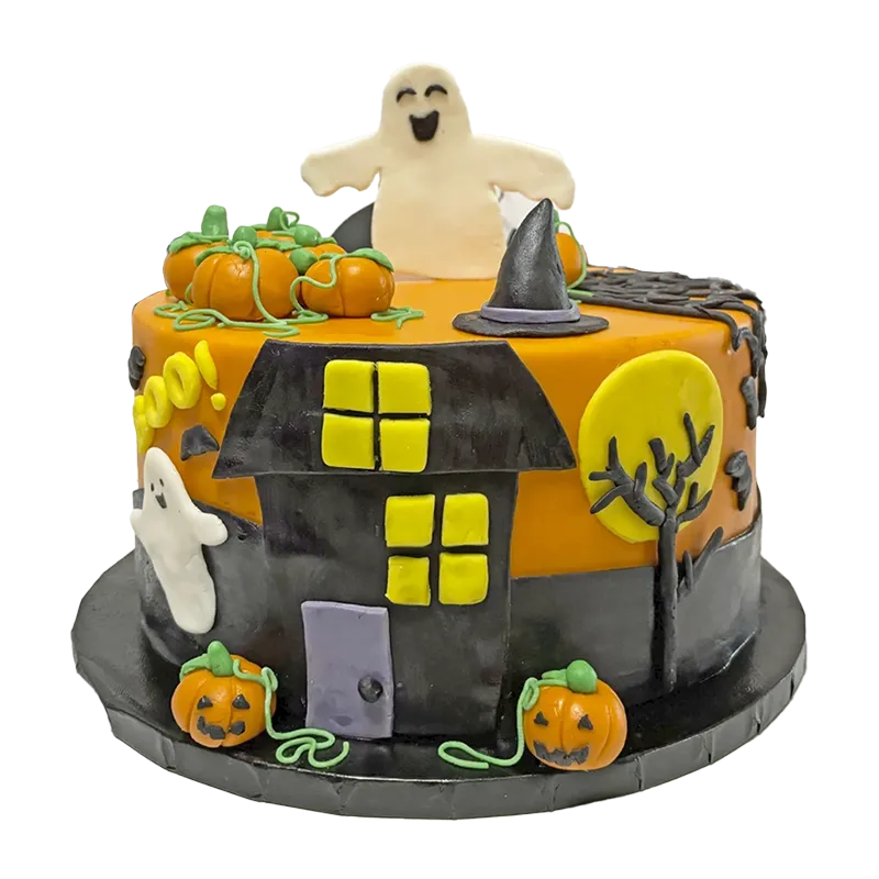 Halloween haunted house cake with ghost topper, pumpkins, witch hat, and spooky tree in orange and black