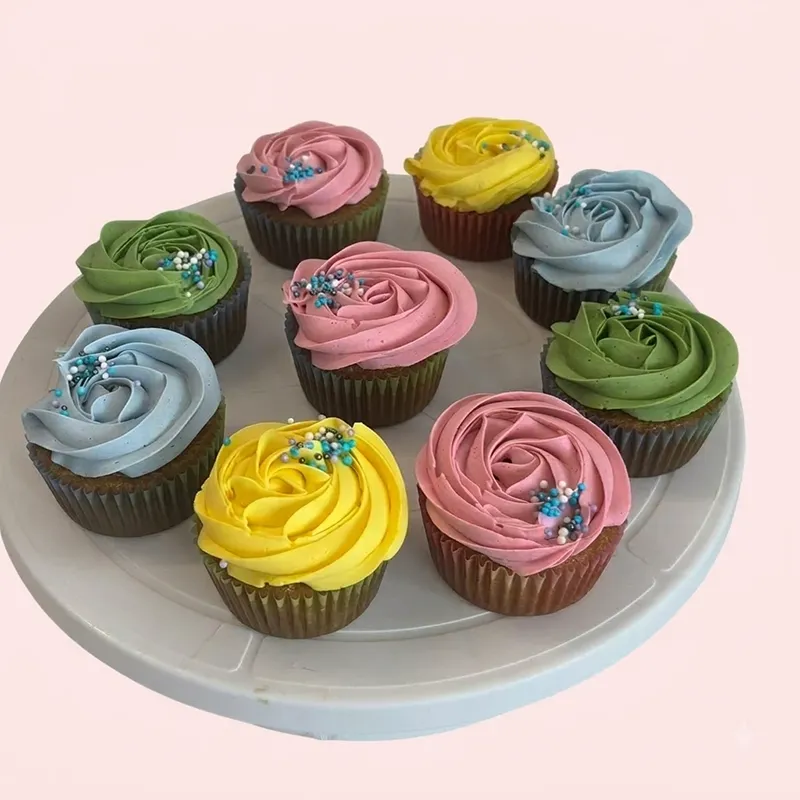 Pastel Swirls cupcakes with pink, blue, green, and yellow rosette frosting and sprinkles