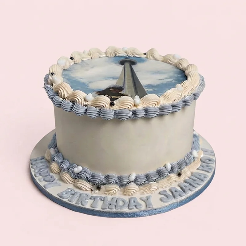 White and blue birthday cake with sky landmark edible image topper by Cakeville Scarborough