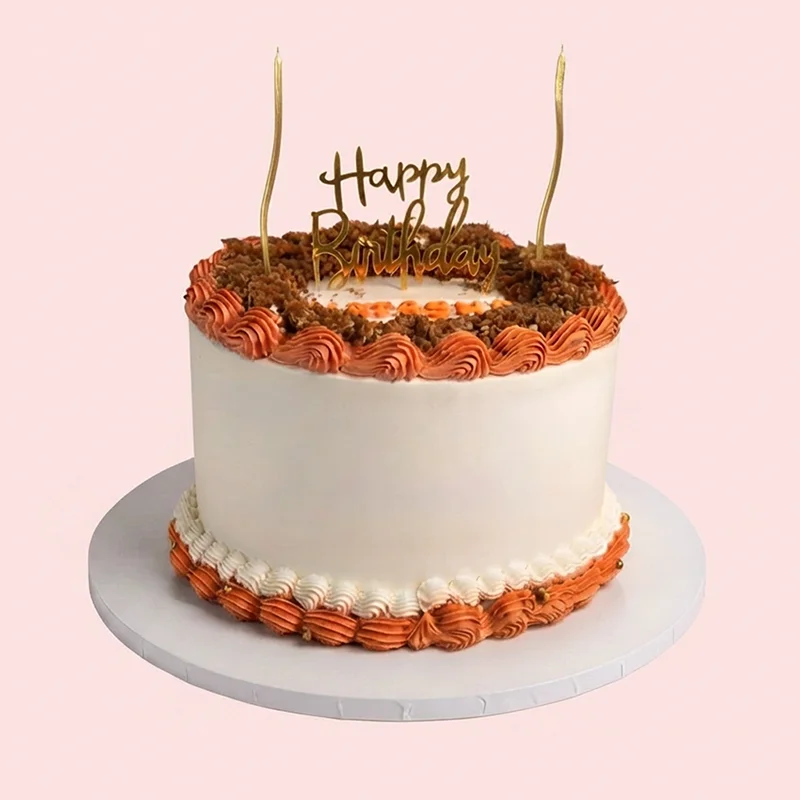 White and caramel Biscoff birthday cake with piped cream border and gold accents by Cakeville Scarborough