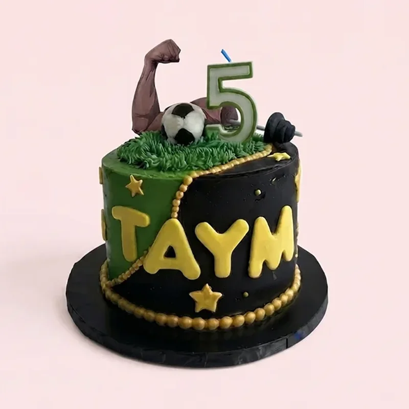 Black and green sports themed birthday cake with soccer ball and gold accents by Cakeville Scarborough