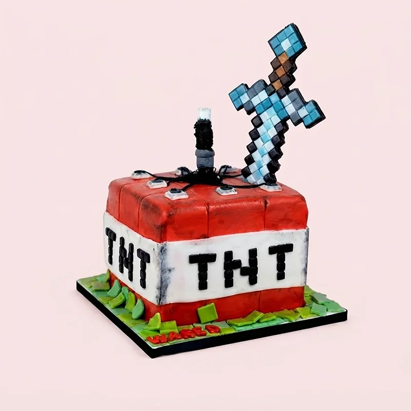 Red and white pixel TNT block birthday cake with fondant sword topper by Cakeville Scarborough