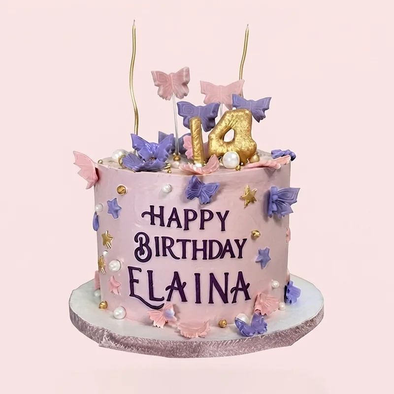Pink birthday cake with purple butterflies, gold candles and pearl accents by Cakeville Scarborough