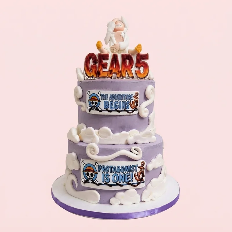 Two-tier lavender pirate adventure themed birthday cake with cloud piping and character topper by Cakeville Scarborough
